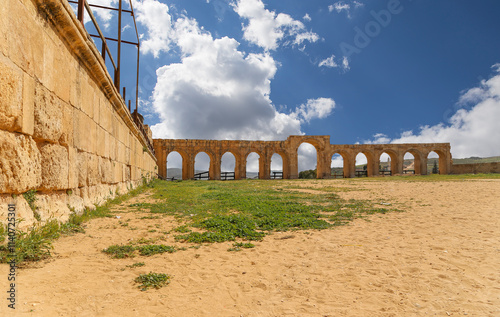 Roman ruins (against the background of a beautiful sky with clouds) in the Jordanian city of Jerash (Gerasa of Antiquity), capital and largest city of Jerash Governorate, Jordan #1140725301