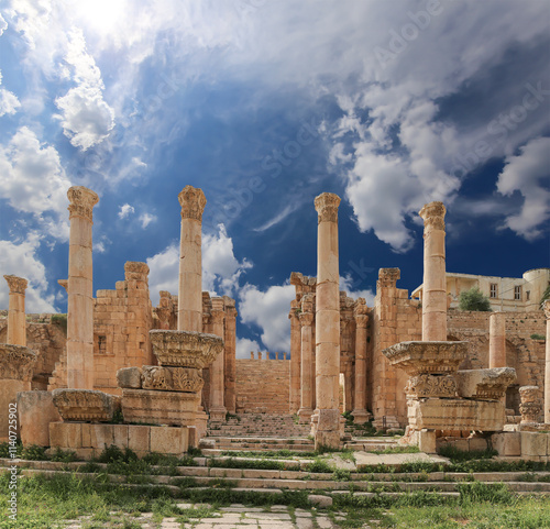 Roman ruins (against the background of a beautiful sky with clouds) in the Jordanian city of Jerash (Gerasa of Antiquity), capital and largest city of Jerash Governorate, Jordan #1140725902