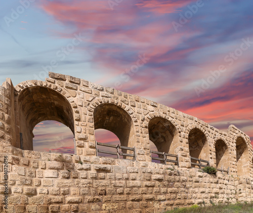 Roman ruins (against the background of a beautiful sky with clouds) in the Jordanian city of Jerash (Gerasa of Antiquity), capital and largest city of Jerash Governorate, Jordan #1140726156