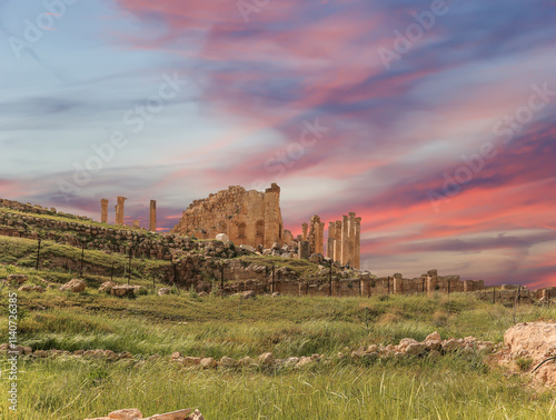 Roman ruins (against the background of a beautiful sky with clouds) in the Jordanian city of Jerash (Gerasa of Antiquity), capital and largest city of Jerash Governorate, Jordan #1140726385