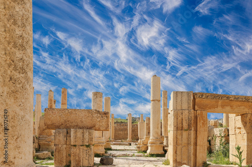 Roman ruins (against the background of a beautiful sky with clouds) in the Jordanian city of Jerash (Gerasa of Antiquity), capital and largest city of Jerash Governorate, Jordan #1140726749