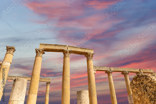 Roman ruins (against the background of a beautiful sky with clouds) in the Jordanian city of Jerash (Gerasa of Antiquity), capital and largest city of Jerash Governorate, Jordan #1140727700