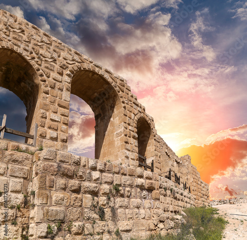 Roman ruins (against the background of a beautiful sky with clouds) in the Jordanian city of Jerash (Gerasa of Antiquity), capital and largest city of Jerash Governorate, Jordan #1140728721