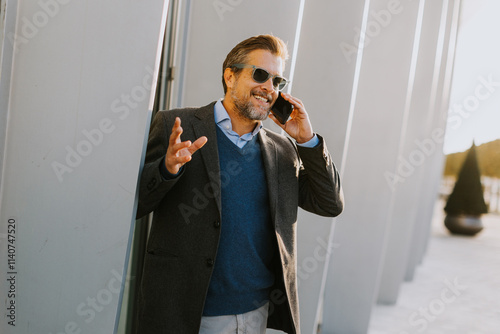 Businessman engaged in a ph...