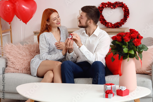 Young man with gift boxes, ...