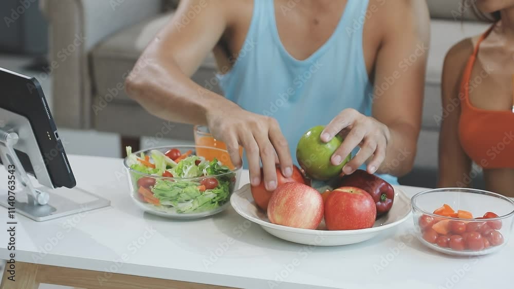 Nutritionist is giving online dietary advice to a client, with fresh vegetables and a salad on the table in front of her Nutritionist is giving online dietary advice to a client, with fresh vegetables and a salad on the table in front of her