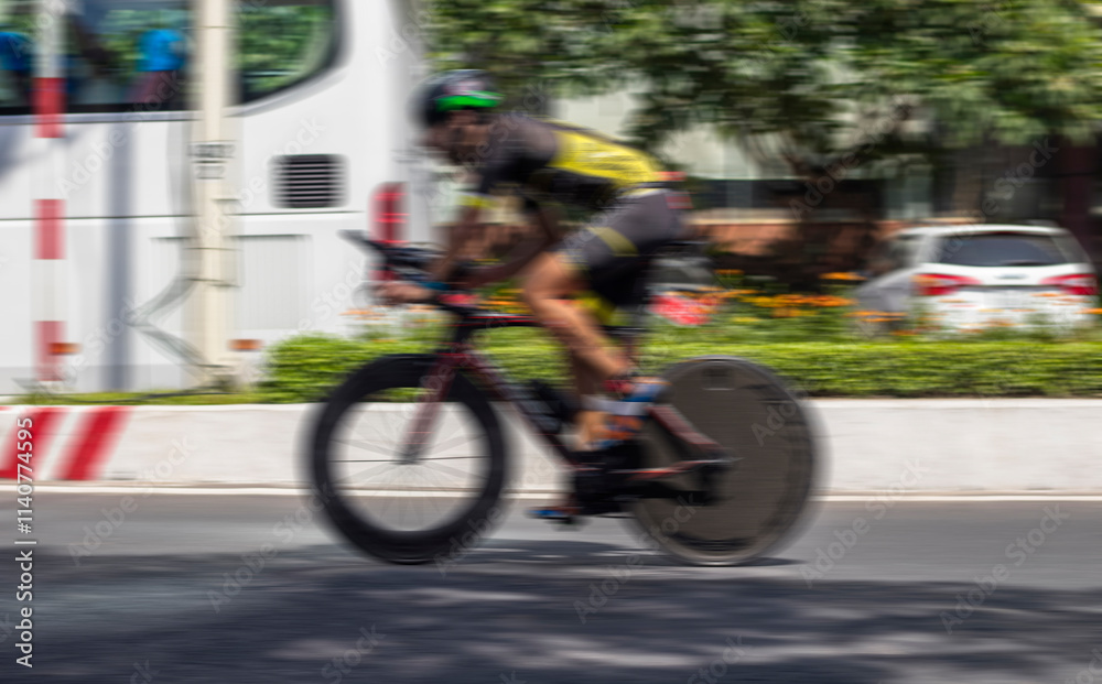 Fototapeta premium Blurred cyclist in motion