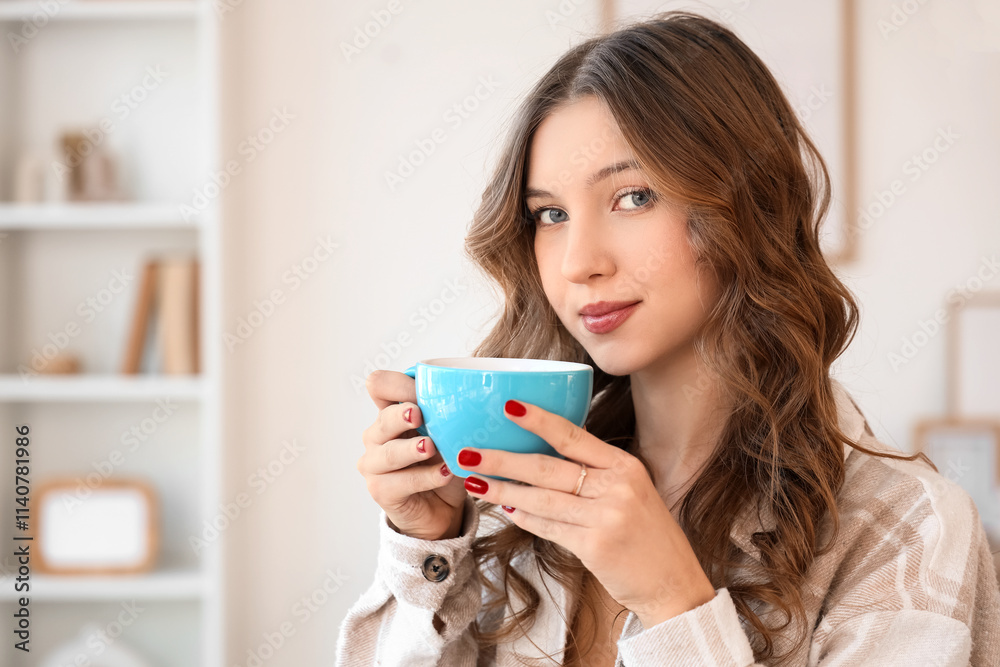 Beautiful young happy woman with cup of tasty coffee at home Beautiful young happy woman with cup of tasty coffee at home
