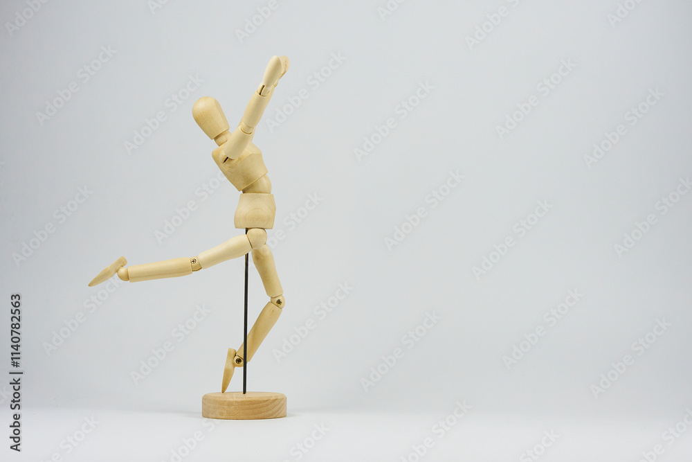 Articulated wooden figure representing the position of some type of physical exercise Articulated wooden figure representing the position of some type of physical exercise