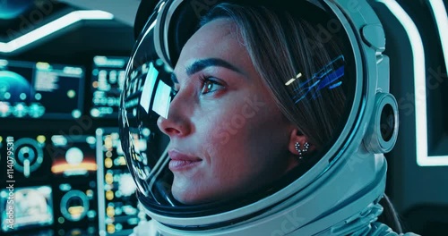 Focused Astronaut in Space Helmet Observing Advanced Spacecraft Controls and Galactic Visuals in Futuristic Cockpit Setting photo