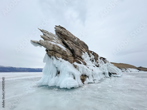 A white van is driving on a snowy road
