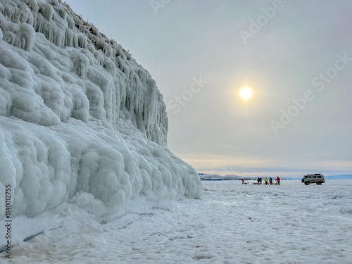 A white van is driving on a snowy road
