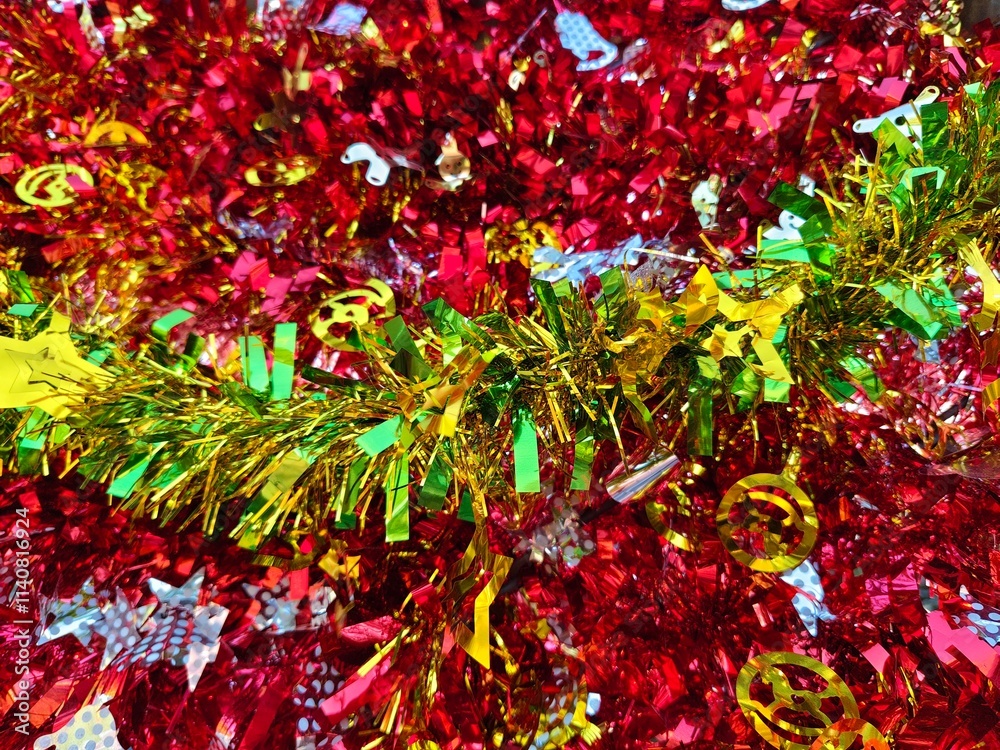 Happy new year background of shiny garlands of merry Christmas multicolored tinsel close-up Happy new year background of shiny garlands of merry Christmas multicolored tinsel close-up