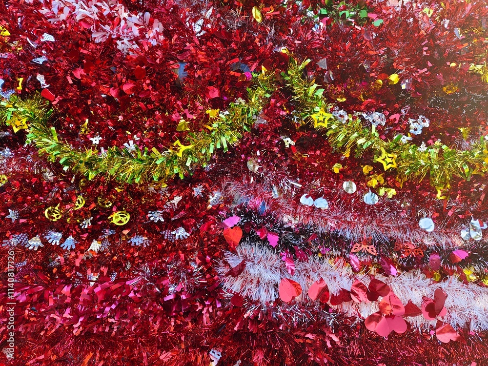Happy new year background of shiny garlands of merry Christmas multicolored tinsel close-up Happy new year background of shiny garlands of merry Christmas multicolored tinsel close-up
