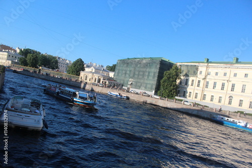 Singer Building, Hermitage Museum Building, Winter Palace, Alexander Column, Palace Square in St. Petersburg, Nevski Prospect, Neva River and tour boats, Peter Pavel Fortress. 
   St.Petersburg Russia