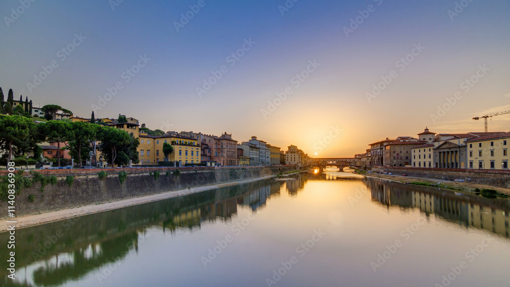 Fototapeta premium Sunset view of Florence Ponte Vecchio over Arno River in Florence timelapse, Italy.