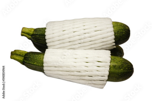 Fresh Green Zucchini Wrapped in Protective Foam for Safe Transport