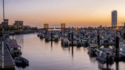 Yachts and boats at the Sharq Marina night to day timelapse in Kuwait. Kuwait City, Middle East photo