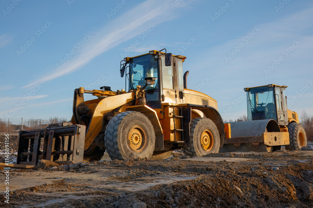 Bulldozer and Roller on Construction Site Bulldozer and Roller on Construction Site
