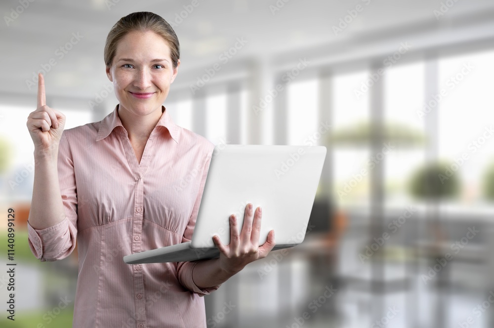 Young happy professional woman working in office Young happy professional woman working in office