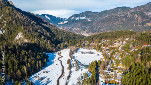 Jezero Jasna, a stunning alpine lake near Kranjska Gora, Slovenia, is a magical sight in winter when its surface freezes and the surrounding peaks are covered in snow photo