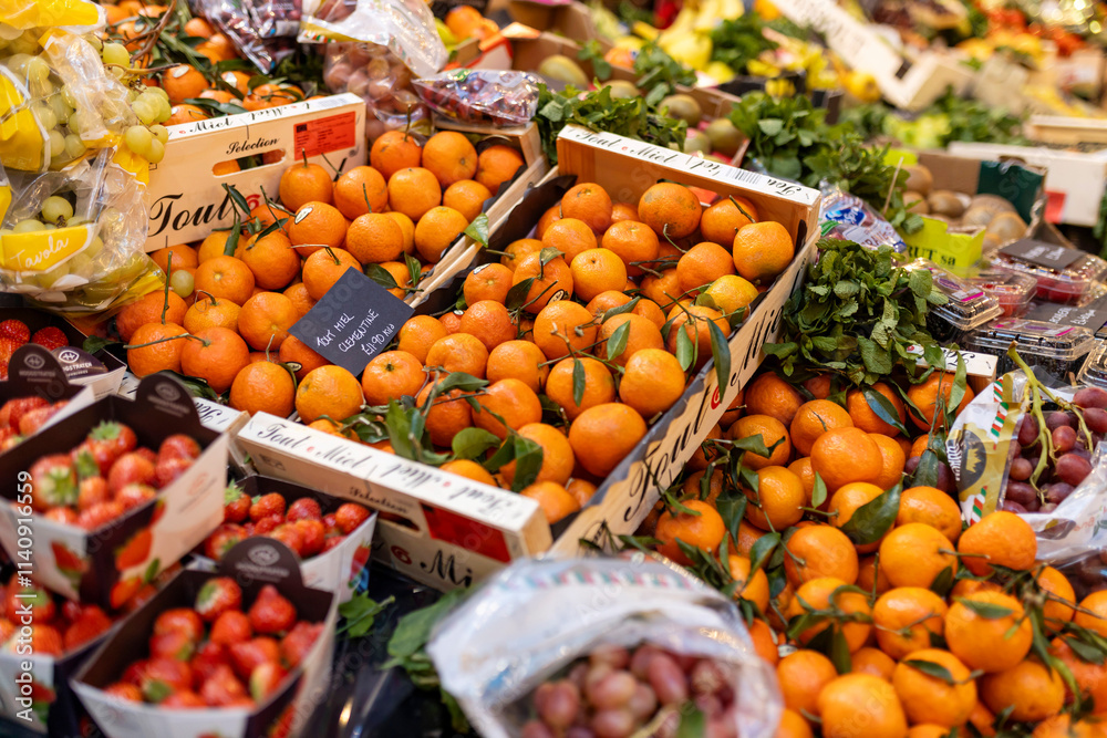 London, UK – December 3, 2024, Mandarins in crates, strawberries, and grapes at Borough Market. London, UK – December 3, 2024, Mandarins in crates, strawberries, and grapes at Borough Market.