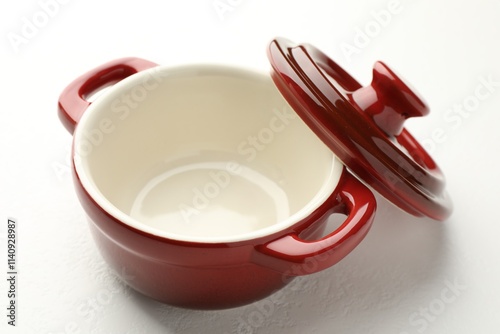 Ceramic casserole and lid on white table, closeup