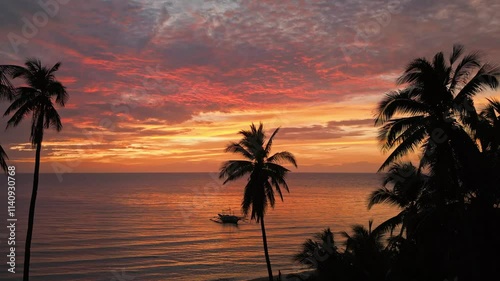 Sunset with Small Boat and Palm Trees