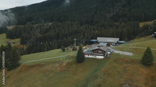 House Near Ski Lift Station On Mountains In Switzerland
