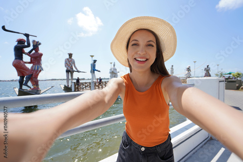 Obraz na płótnie Holidays in Aracaju, Brazil. Selfie photo of traveler girl on promenade Largo da Gente Sergipana in Aracaju, Sergipe, Brazil. w salonie