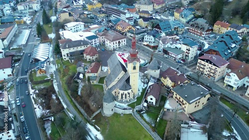 Tarvisio, a charming town in the Italian Alps, showcases its winter magic from the air. Blanketed in snow and surrounded by majestic mountains, this alpine retreat offers picturesque views of its cozy