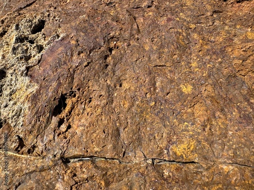 Background texture of brown stone wall. Surface stone zinc, copper mine close-up background pattern. Stone hematite, jecheon, chungbuk surface. Granite stone texture. Natural mountain stone.  photo