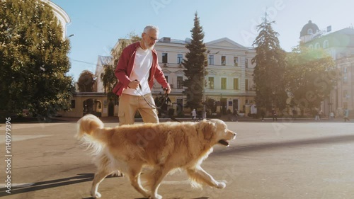 Senior man skateboards joyfully with companion dog