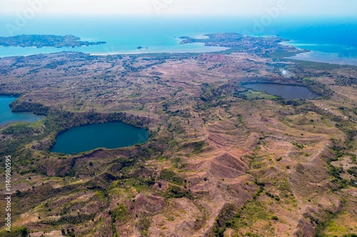 Aerial view from Mont Passot over the crater lake Lac Amparihibe and the Indian Ocean, Nosy Be, Madagascar. photo