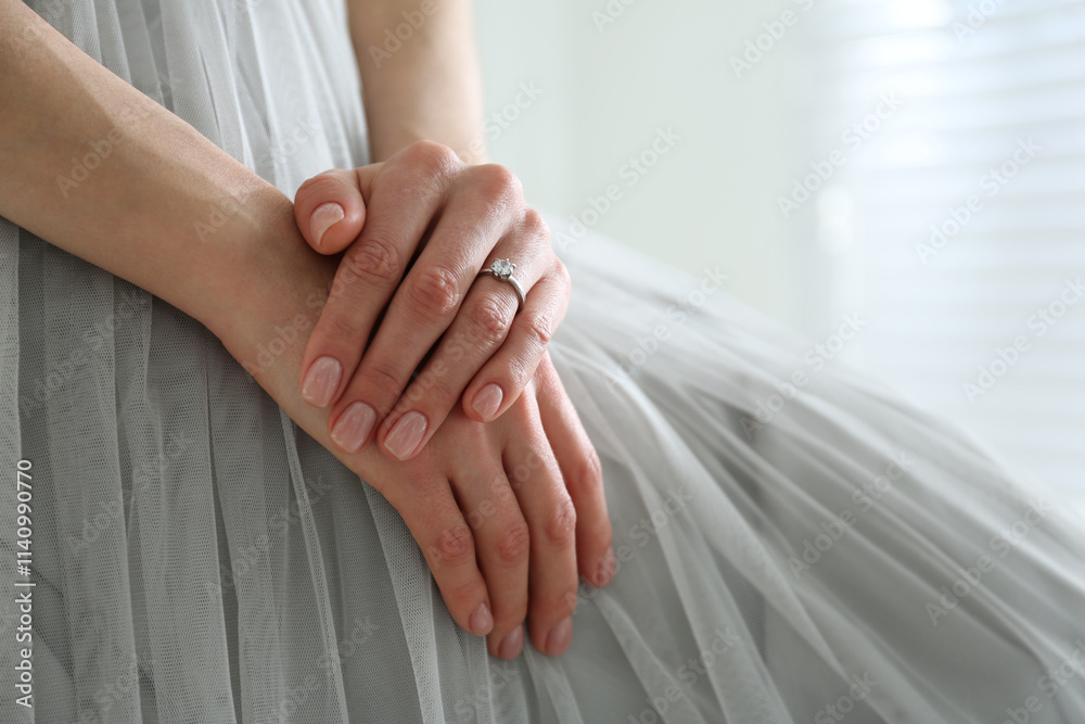 Young bride wearing beautiful engagement ring, closeup Young bride wearing beautiful engagement ring, closeup