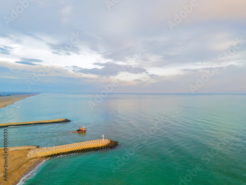 Wallpaper Mural defauTurkiye Sakarya Karasu Adapazari Aerial view of a tranquil coastal harbor with breakwaters and a small vessel.High-angle, full shot of a serene coastal harbor, showcasing a calm turquoise sea met Torontodigital.ca