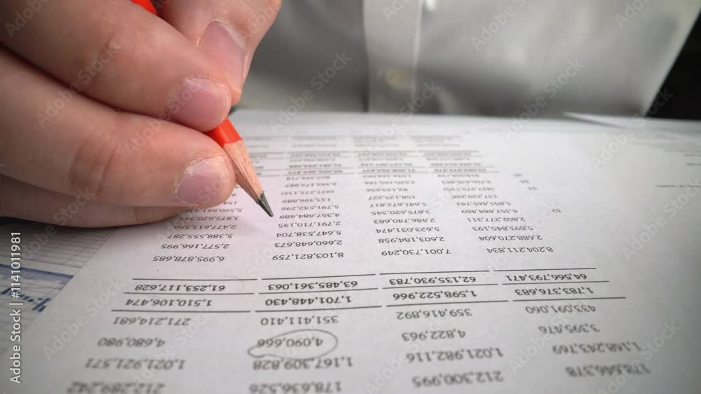 Accountant analyzing business marketing data on paper dashboard at office table. Corporate finance and money accounting concept.