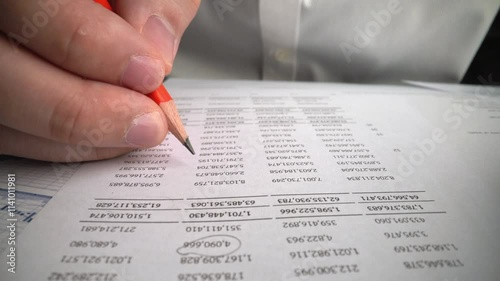 Accountant analyzing business marketing data on paper dashboard at office table. Corporate finance and money accounting concept.