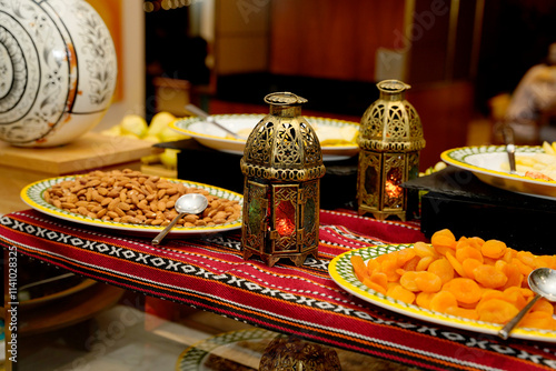 Closed view of buffet featuring colourful dried fruits and nuts, set alongside ornate Moroccan lanterns, creating a warm and festive atmosphere for culinary exploration.
