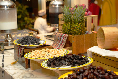 A vibrant buffet display featuring an assortment of dried fruits dates, nuts, and fresh pineapple, elegantly arranged and inviting guests to savor a taste of tropical indulgence.
