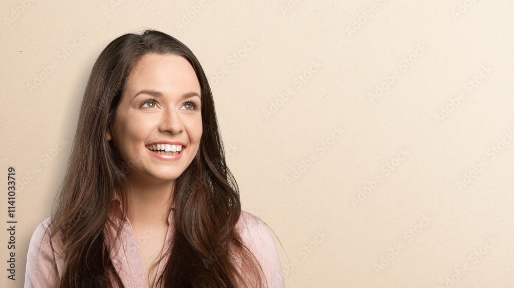 Portrait of young happy woman posing on background Portrait of young happy woman posing on background