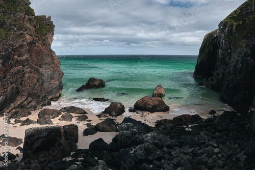 A high cliff in a rocky sea cove in the north of the Isle of Lewis. Garry Beach, Isle of Lewis, Scotland, UK