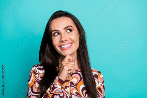 Photo of adorable dreamy girl wear print shirt arm chin looking empty space isolated turquoise color background