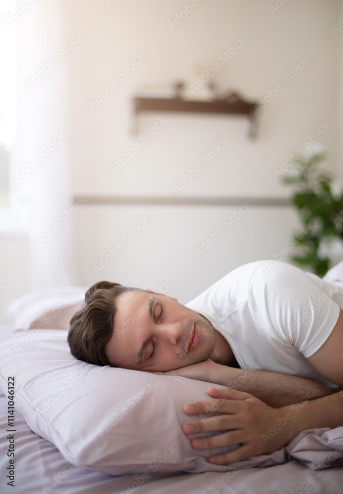 A serene bedroom scene featuring a man peacefully sleeping on a white pillow with natural light streaming through a window, soft bedding, and greenery creating a calm and cozy atmosphere. A serene bedroom scene featuring a man peacefully sleeping on a white pillow with natural light streaming through a window, soft bedding, and greenery creating a calm and cozy atmosphere.