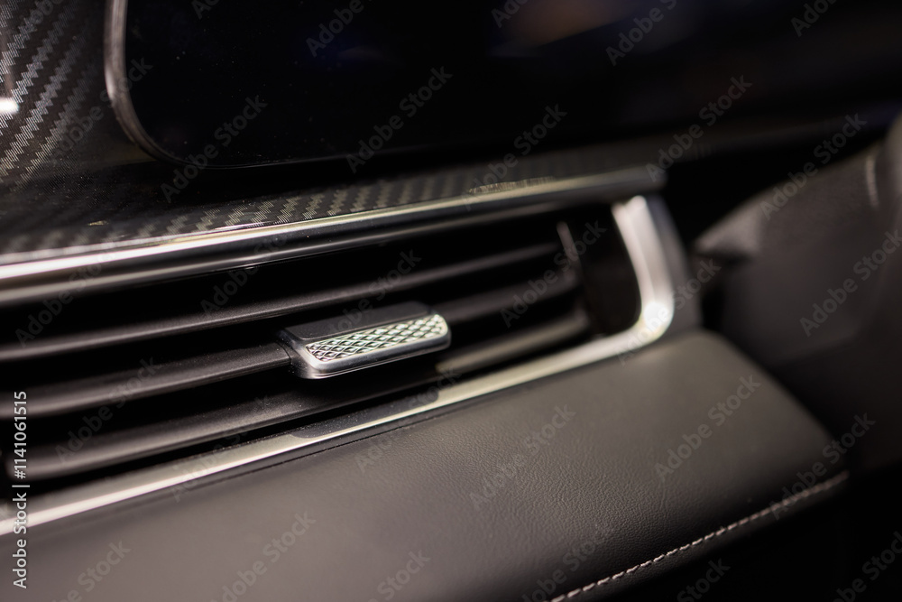 Closeup of car dashboard air vents near gear shift Closeup of car dashboard air vents near gear shift
