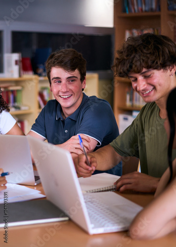 Vertical. Group young high school students doing classwork together using laptop sitting in library. Happy Generation z classmates meeting brainstorming studying with computers and notebooks