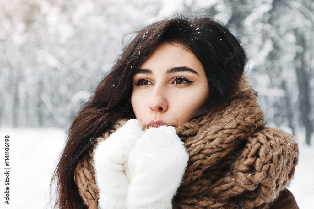 Cold Winter. Dreamy Girl Blowing On Hands In Gloves Trying To Warm Up Standing In Snowy Forest Cold Winter. Dreamy Girl Blowing On Hands In Gloves Trying To Warm Up Standing In Snowy Forest