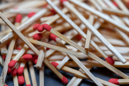 Cluttered and disorganized set of red-headed phosphor sticks