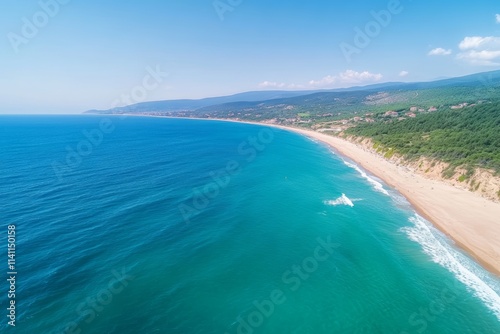 A beautiful blue ocean with a beach in the background