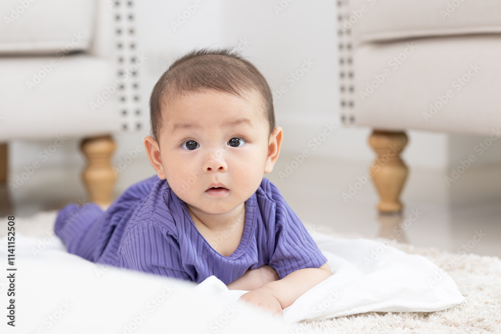 Asian newborn baby boy Lying in the living room on a white blanket. Asian newborn baby boy Lying in the living room on a white blanket.